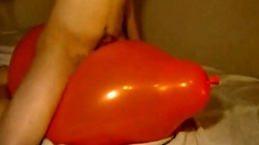 Big inflatable orange balloon humping cum