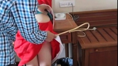 caning an Asian slut in cosplay costume