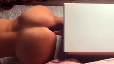 Big-Assed MILF Masturbates with Dildo for Intense Orgasm on