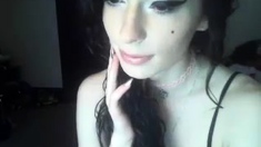 Brunette enjoys the toy on gaping pussy while masturbating