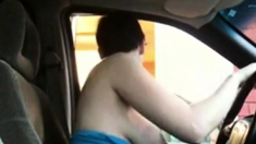 Woman showing her tits in a drive through