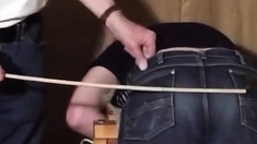 Caned over tight jeans Daddy boy